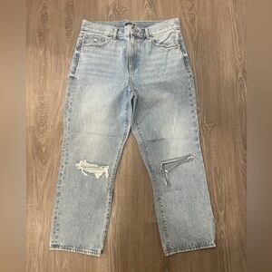 Woman’s Light Blue High Rise Distressed Jeans